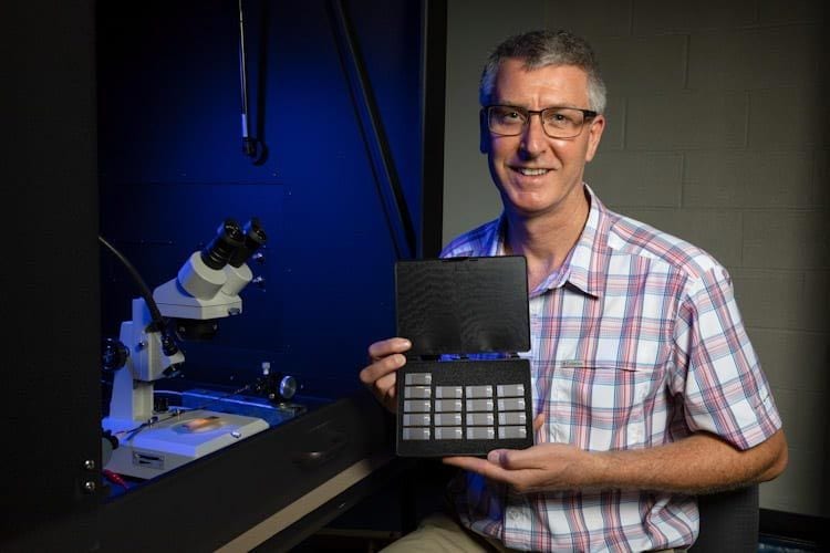 Lead researcher Paul Thibado works on graphene chips for the University of Arkansas.