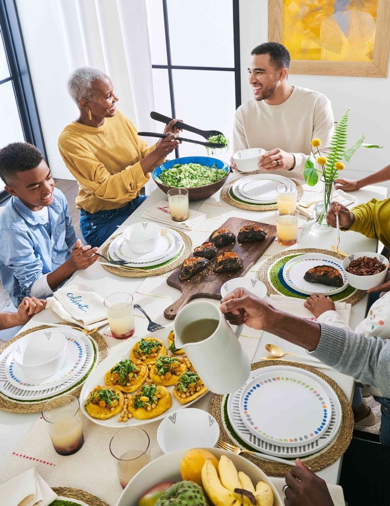 Family sits down at dinner with stylish offerings from Pottery Barn's new collection with the Black Artists + Designers Guild.