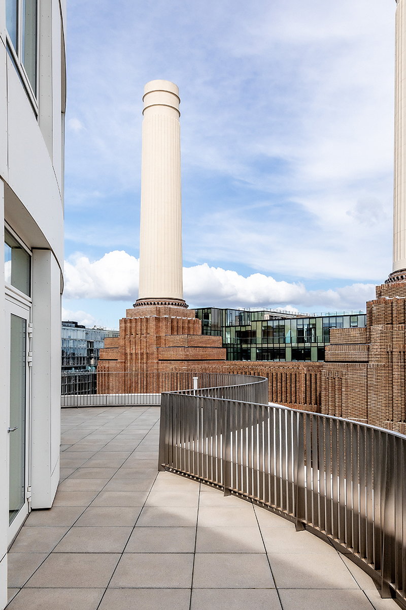 Communal outdoor balcony space in Prospect Place overlooking London's iconic Battersea Power Station.
