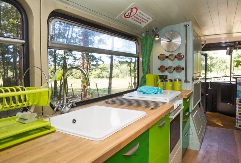 Lime green kitchen area inside Adam Collier-Woods' renovated 