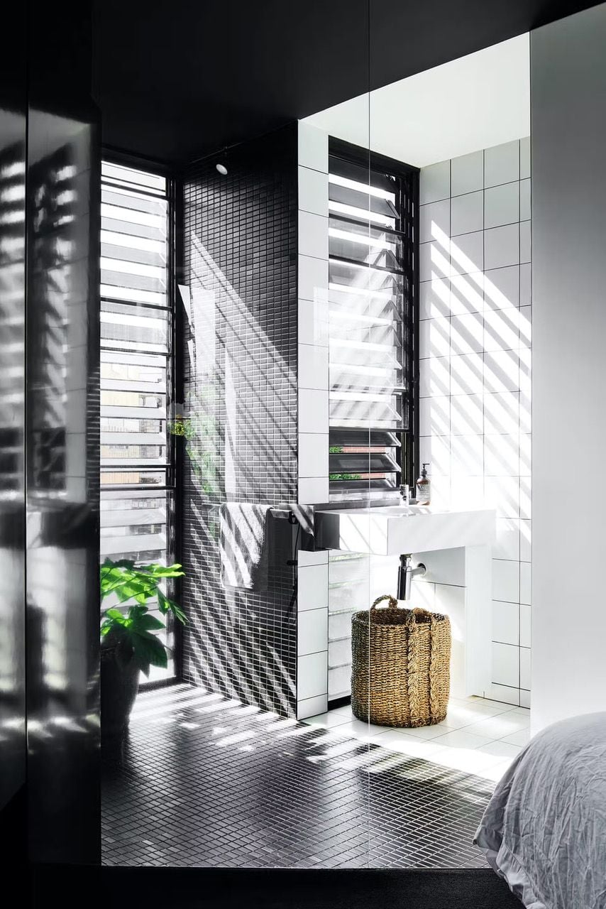 Light-filled black and white bathroom space inside the Splinter Society architects' spiky black home in Melbourne.