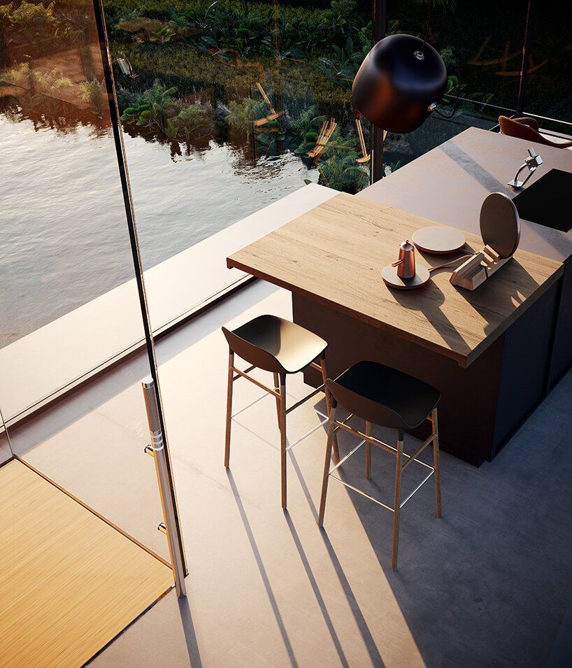 Minimalist kitchen area in Adriano Design's new vertical glass house concept.