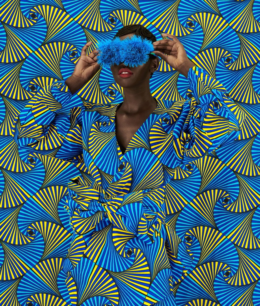 Kenyan woman dons a bold hairstyle and vibrant patterned textiles for artist Thandiwe Muriu's 