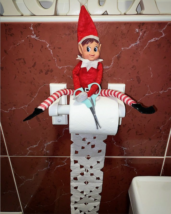 Instagram user Chloe Boyle arranged her Elf on the Shelf with scissors over a roll of toilet paper with ornate snowflake cut-outs. 