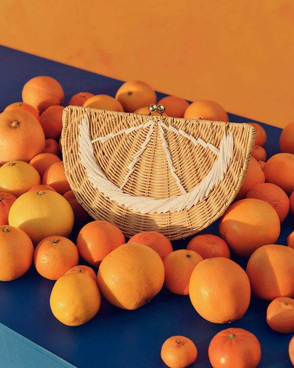 Orange-slice inspired handbag featured in Tabatha Brown's summer clothes and accessories collection with Target. 