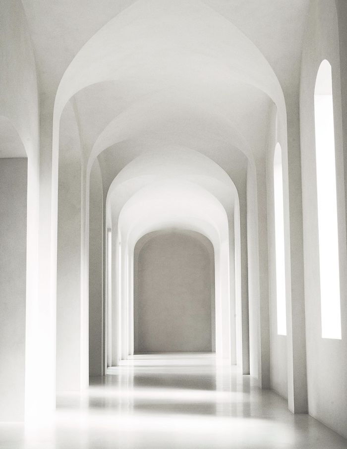 An all-white corridor inside Kim and Kanye's minimalist LA mansion.