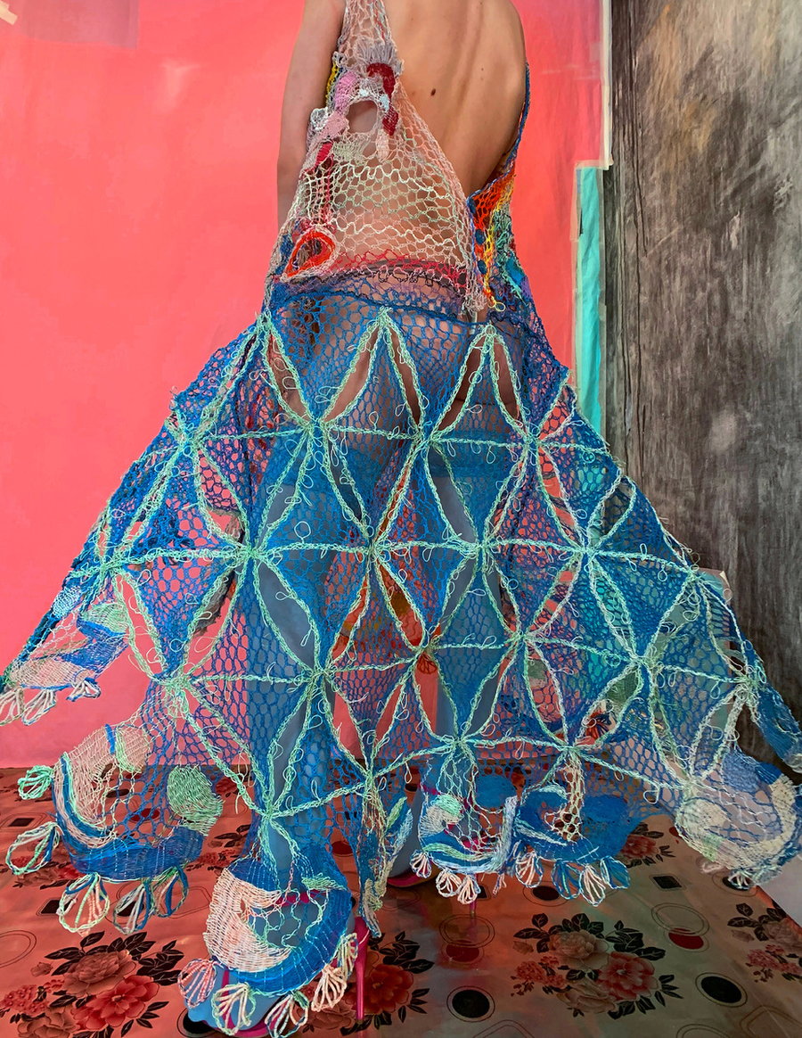 An intricate, colorful dress made from recycled electrical wires, designed by Alexandra Sipa.