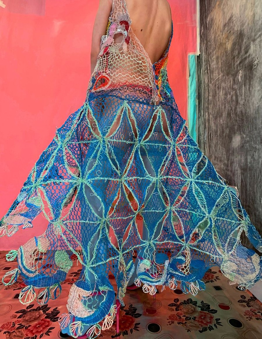 An intricate, colorful dress made from recycled electrical wires, designed by Alexandra Sipa.