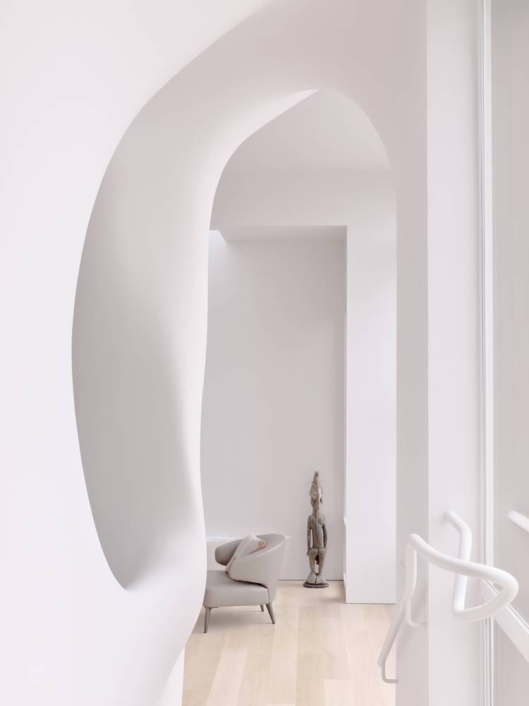 Peep into the sculptural cloud0like living area of the OPA Architects-renovated 