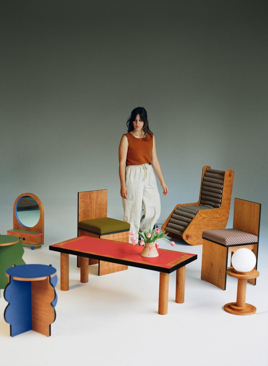 Adi Goodrich surrounds herself with quirky wooden pieces by her Sing Thing furniture brand. 