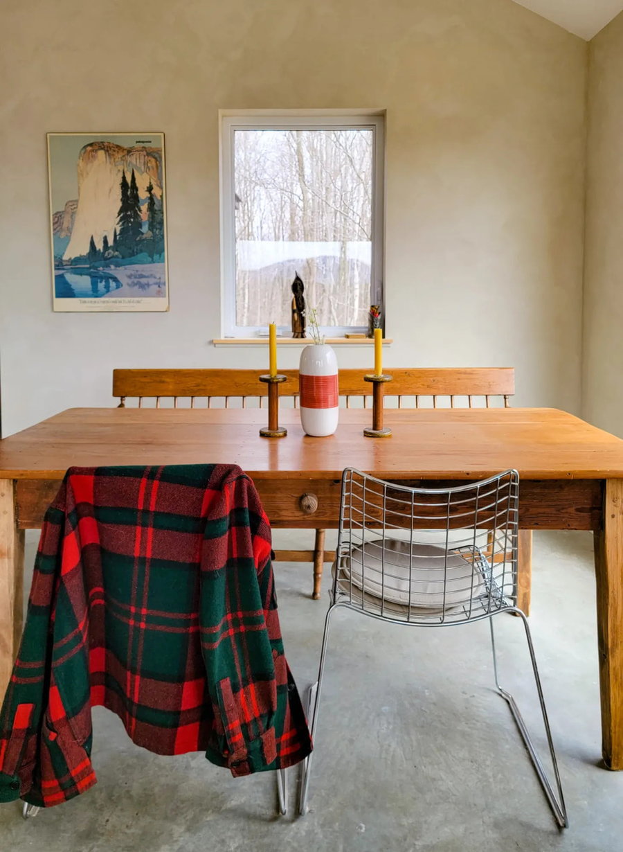 Homey dining table inside Leigh and Mark Partington's cozy minimalist cottage.