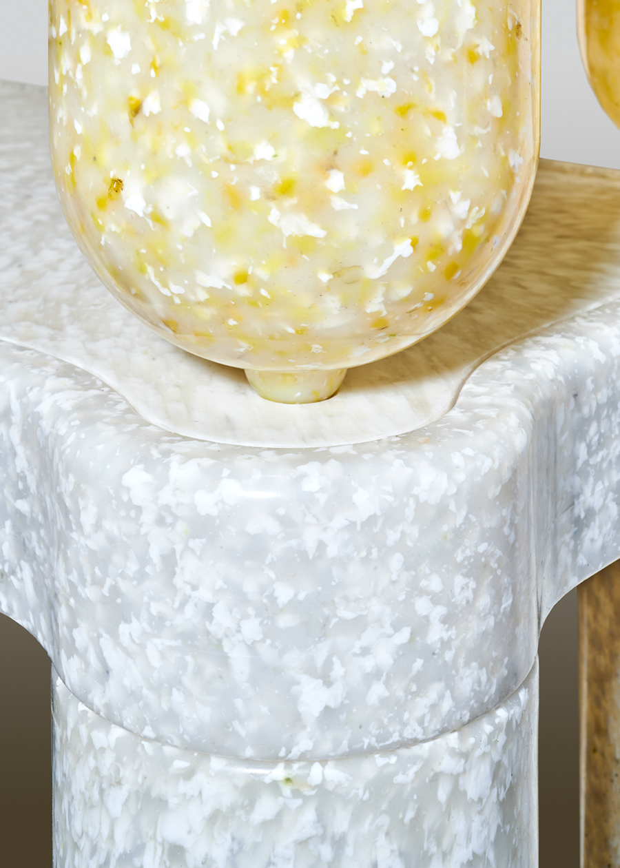 Close-up view of the recycled Afterlife furniture's terrazzo-like material pattern. 