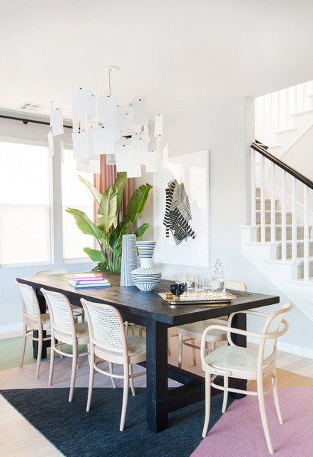 Wicker chairs, sleek tables, and carefully placed plants are sure to make your dining room stylish.