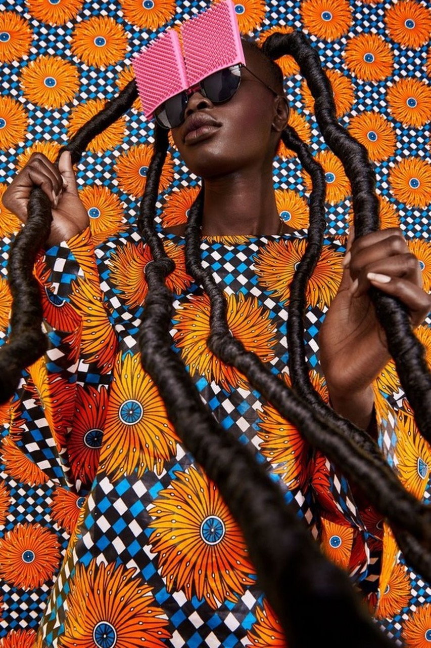 Kenyan woman dons a bold hairstyle and patterned textiles for artist Thandiwe Muriu's 