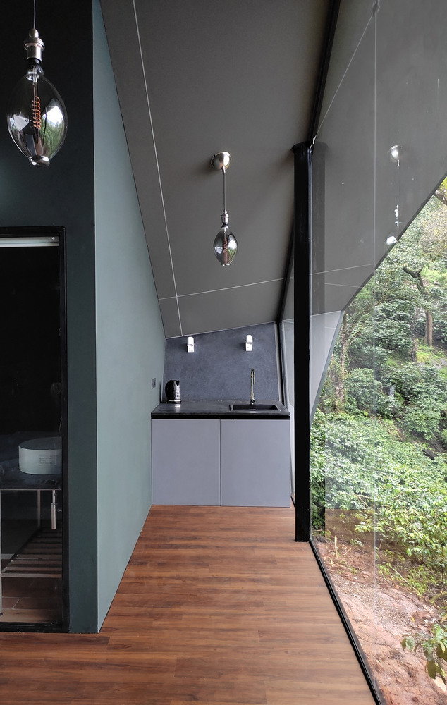 Utilitarian kitchenette space inside Cabin A24 overlooks the surrounding mountains.