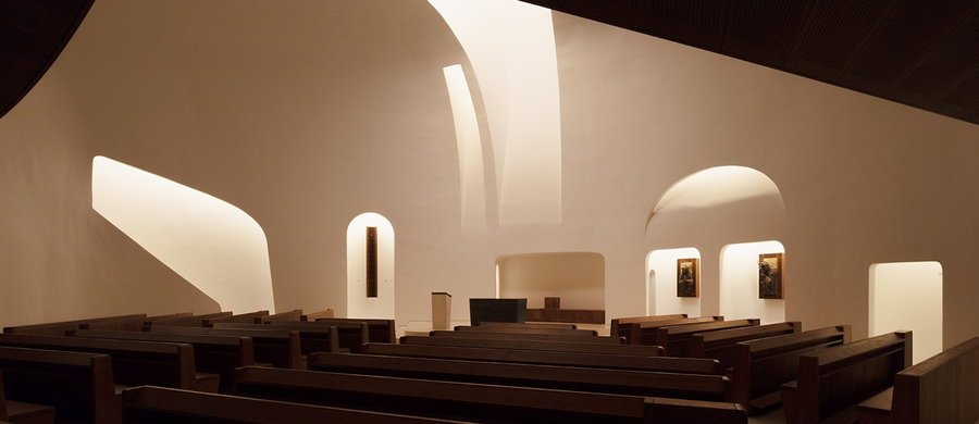 Side view of the minimalistic chapel area inside the Saint Pope John Paul II Church. 