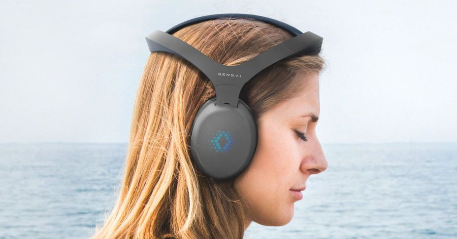 Woman closes her eyes and allows her equipped Sens.ai headset to train her brain