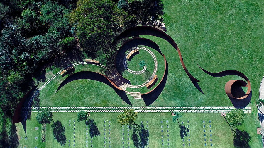 Overhead shot of the spiraling structures inside Brazil's Memorial Cemetery Parque das Cerejeiras.
