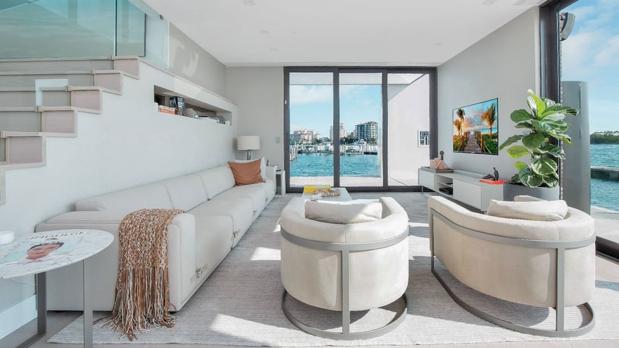 A similarly sleek lounge area inside the home offers great views of the surrounding seas.