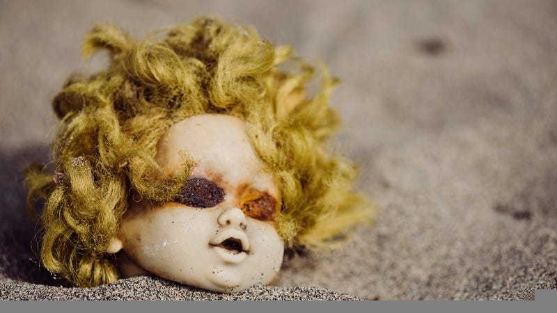 Sand-encrusted doll head washed up on the Texas Coastal Bend.