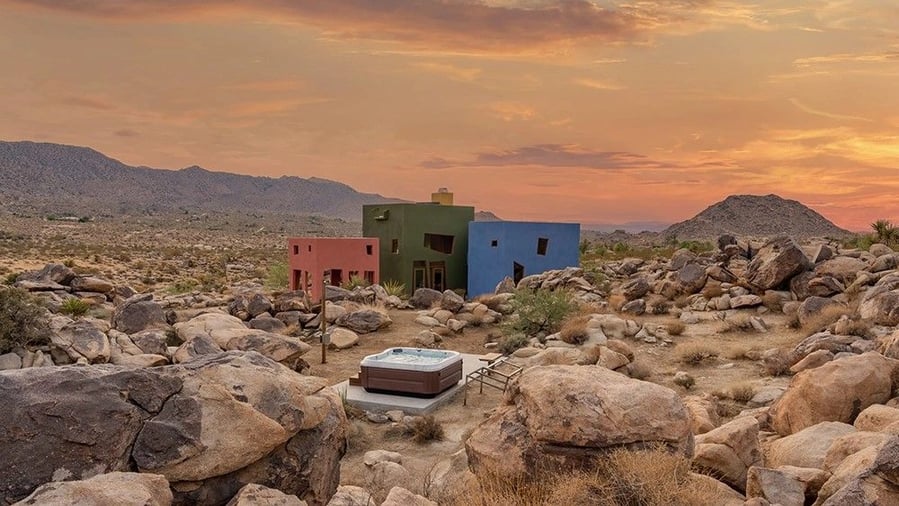 Small hot tub outside the Monument House blends seamlessly into the surrounding boulders.