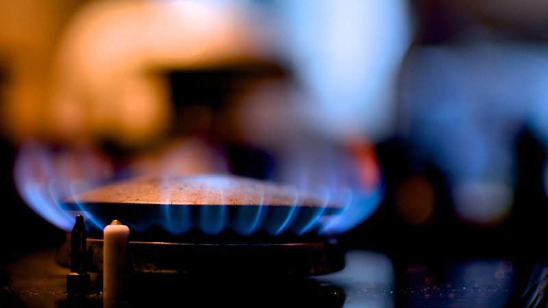 Close-up shot of a gas-powered kitchen stove burner 