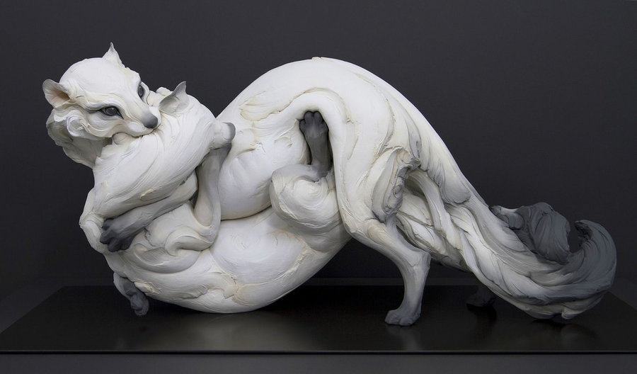 A clay sculpture of two entangled ermines by artist Beth Cavener.