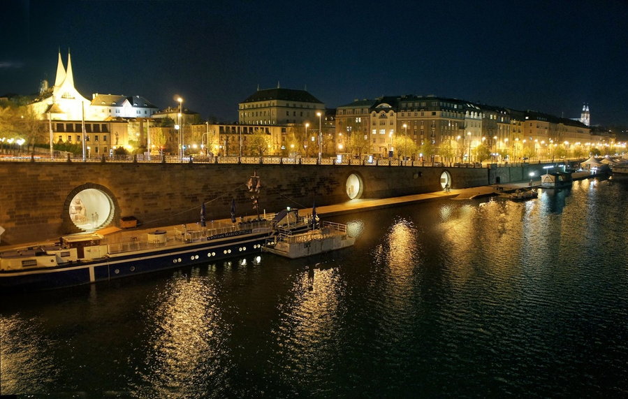 Prague's Brainwork Studio-restored Vltava River vaults emit a warm glow at night