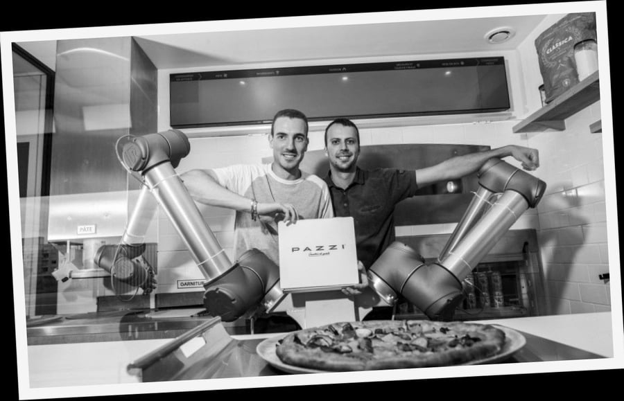 Pazzi founders Sébastien Roverso and Cyrill Hamon pose with their now-famous robot chefs.