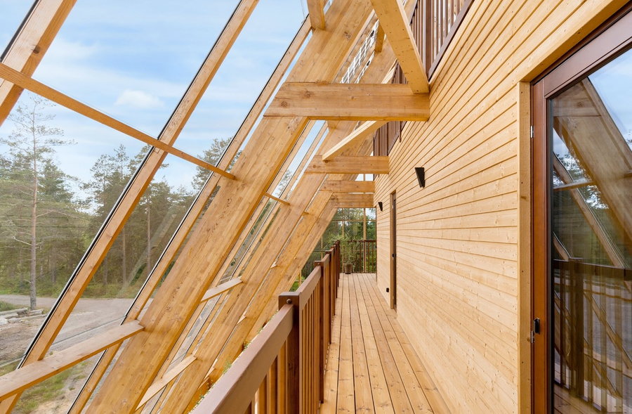 Small wooden walkway in the Atri structure between the outermost greenhouse wall and the true exterior wall of the home.