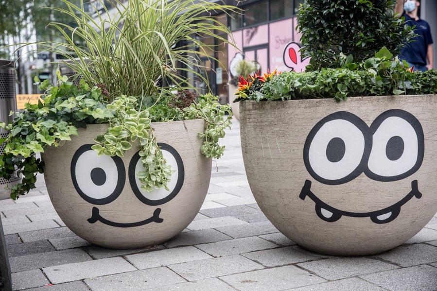 Even the planters near Burgerman's work have been decked out with smiles and googly eyes of their own. 