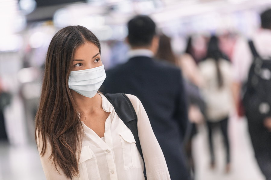 Young woman wears a surgical mask as she does her part to curb the spread of the novel coronavirus.