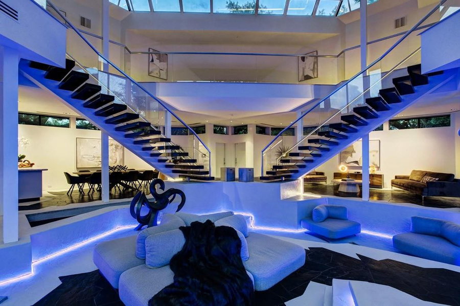 Two large floating staircases grace the back of the Darth Vader House's main living area.