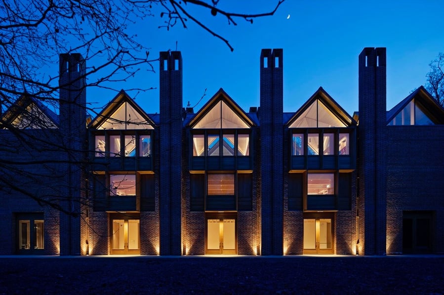 Nighttime view of the Níall McLaughlin-designed New Library at Magdalene College in Cambridge, UK.