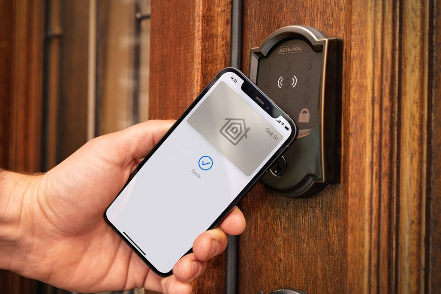 Person opens their door with their smartphone using a Schlage Encode Plus Wi-Fi Door Lock
