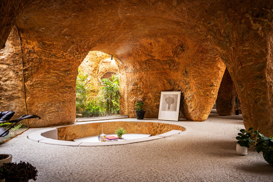 Sunken lounge and table space in the otherwise-sparse living area of the House and Restaurant Cave.