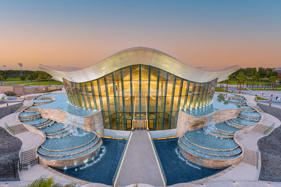 Elegant, oyster-shaped structure that houses the Deep Dive Dubai pool. 