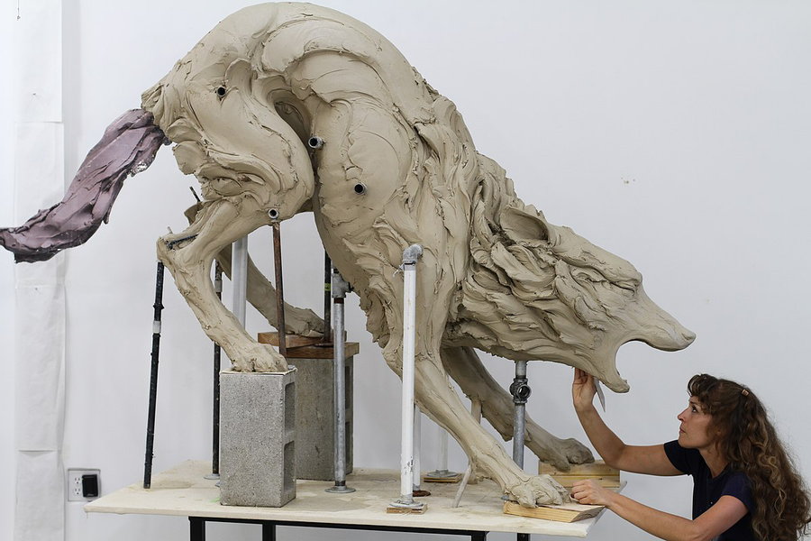 Beth Cavener hard at work on her wolf sculpture. 