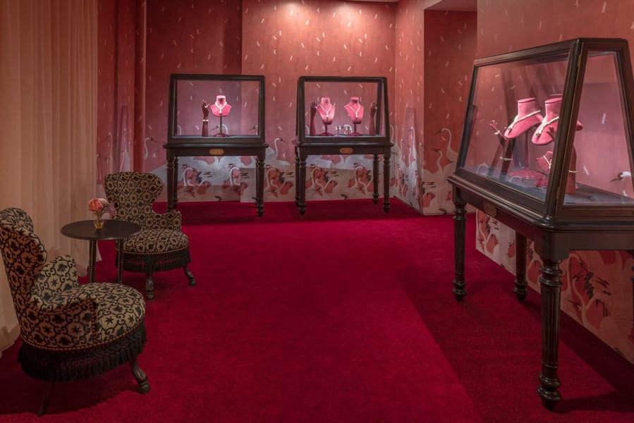 Gucci jewelry and accessories on display in a bold pink room inside Dallas' Preston Hollow mansion.