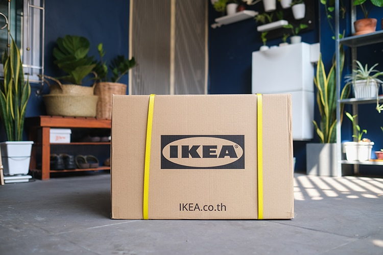 A sealed IKEA box sits waiting in a living area, ready to go back to the store as part of the company's new Buy Back program.