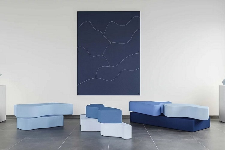 The sculptural pieces of Mousarris Design Studio's Summit Sofa pulled down from their frame and arranged on the floor.