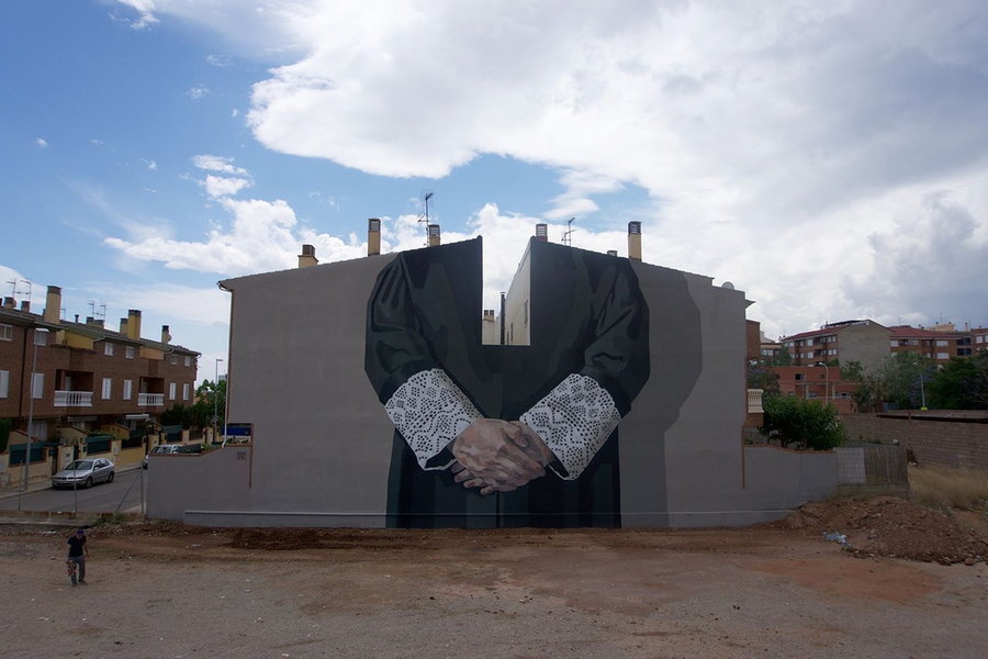 A Hyuro mural of a judges robes, painted in Spain to protest the acquittal of men accused of gang-raping a woman.