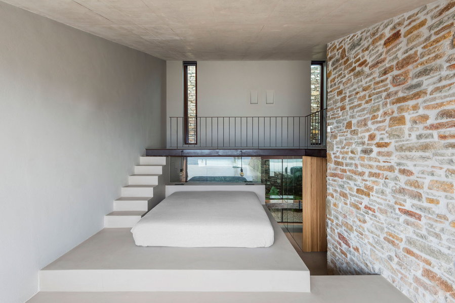 Sleek minimalist bedroom inside the Mold Architects-designed 