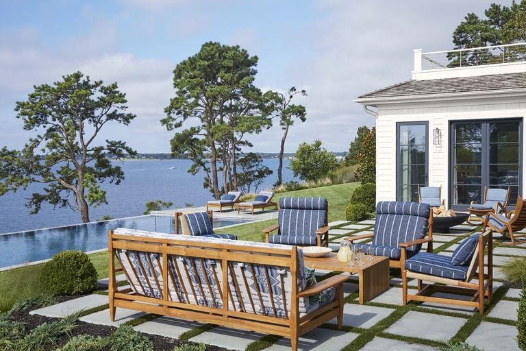 Bring the Hamptons feel outdoors with sunny wooden benches and coastal blue hues.