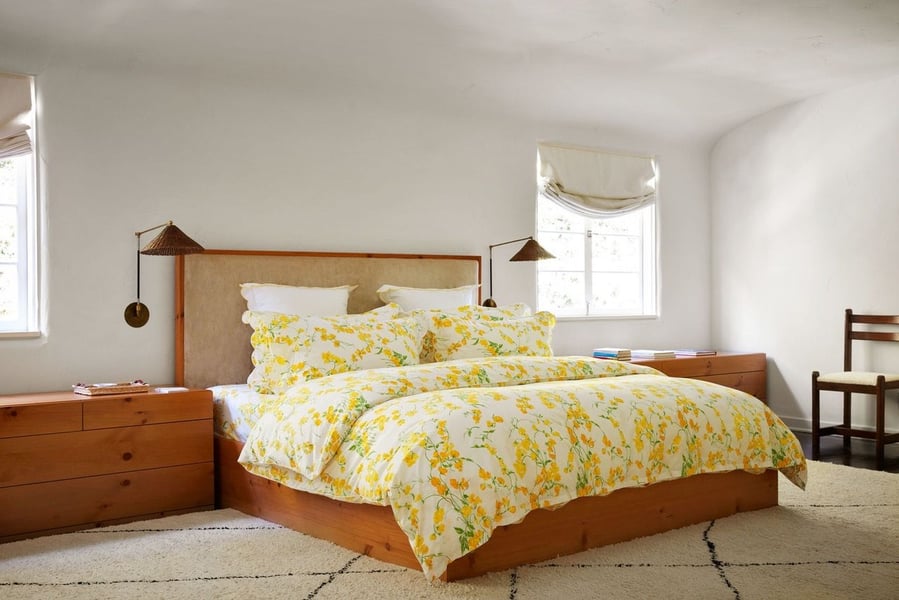 Simple, inviting primary bedroom in film producer Grace Morton's eclectic Spanish Style LA home. 