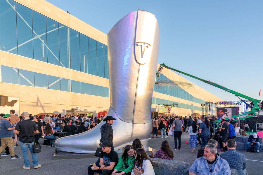 Large metallic cowboy boot outside Tesla's recent Cyber Rodeo event.
