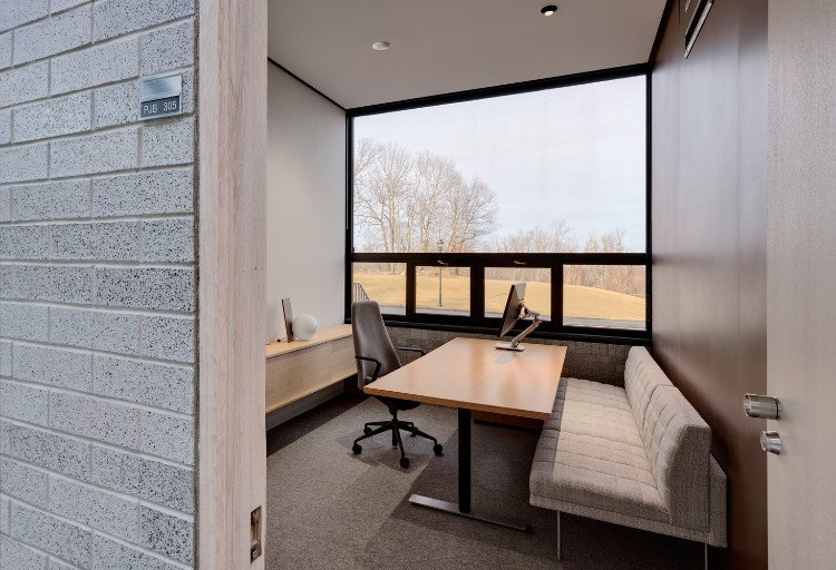 an earth toned office next to a field in the fall