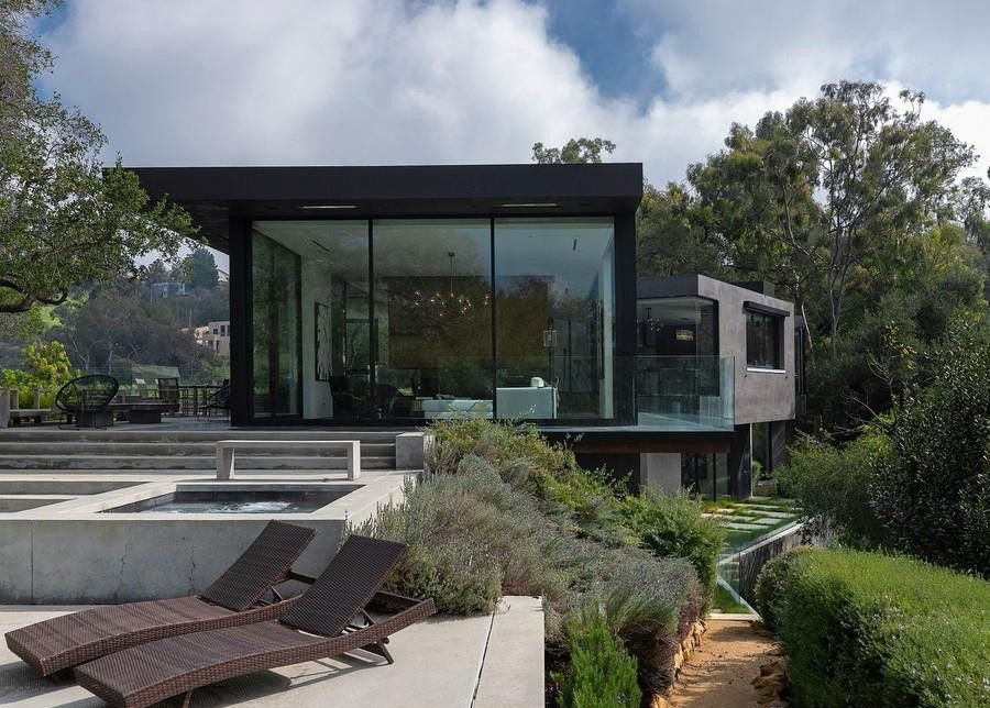 Exterior daytime shot of film producer Ken Kao's sleek, glass-heavy Beverly Hills mansion. 