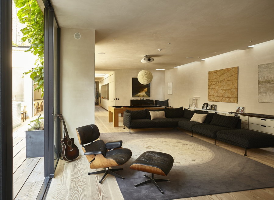 The cozy, contemporary living area featured in the Round House's frontmost volume