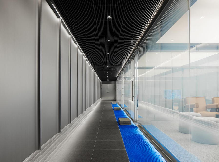 Sleek minimalist walkway in Hana Bank's new Intg-designed lounge space in Seoul. 